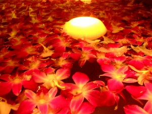 candle in waterflowers